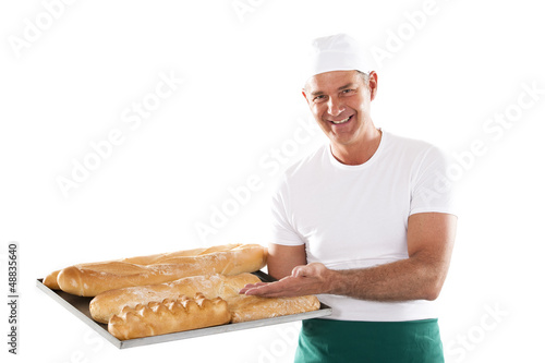 Photo: Chef preparing menu Baker holding tray with bread Chef preparing menu Baker holding tray with bread