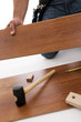 Carpenter working with wood planks