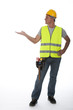 Construction worker wearing hard hat and vest