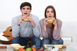Photo: Two students eating burgers Two students eating burgers