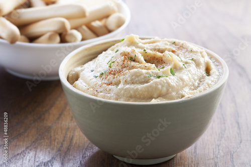 Photo: Chickpea hummus bowl with bread sticks Chickpea hummus bowl with bread sticks