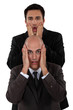Shocked businessmen making faces