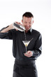 Bartender pouring cocktail in glass