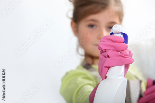 Photo: Young girl cleaning Young girl cleaning