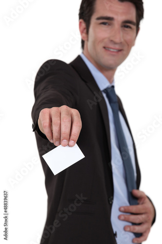 Photo: businessman giving his visit card businessman giving his visit card