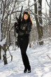 Photo: woman with a rifle in winter forest woman with a rifle in winter forest