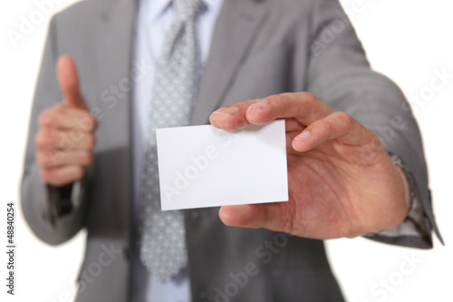 Photo: Executive with a blank businesscard Executive with a blank businesscard