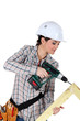 Woman constructing wooden frame