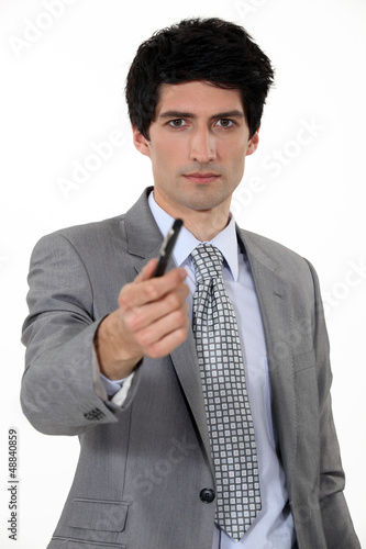 Photo: Businessman offering pen Businessman offering pen