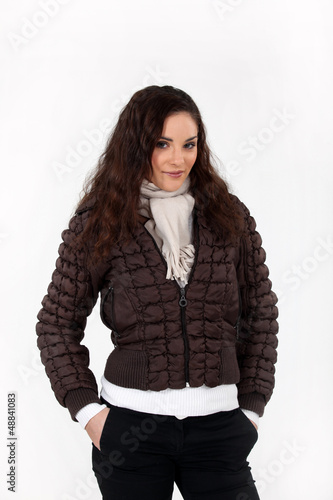 Photo: Young brown-haired woman posing on white background Young brown-haired woman posing on white background