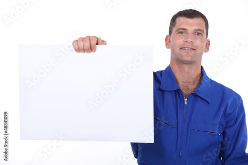 Photo: man showing a piece of paper man showing a piece of paper