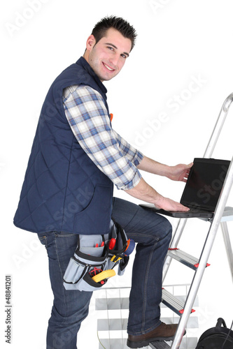 Photo: Electrician stood by step ladder Electrician stood by step ladder