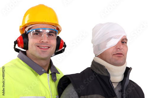 Photo: craftsman helping injured colleague craftsman helping injured colleague