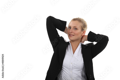 Photo: beautiful blonde with arms behind her head relaxing beautiful blonde with arms behind her head relaxing