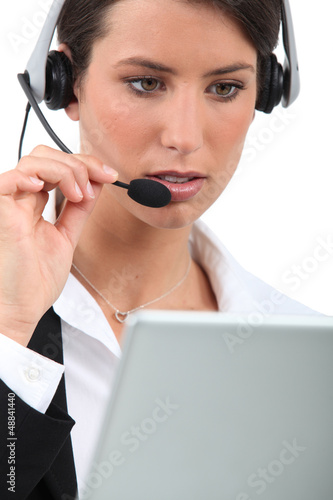 Photo: close-up of a woman with headset close-up of a woman with headset