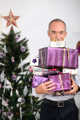 Photo: Man with Christmas gifts Man with Christmas gifts