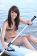 Young brunette in a canoe