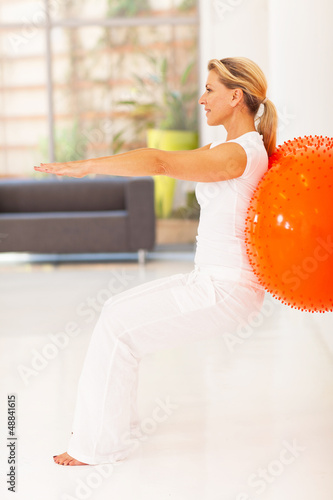 Photo: fit middle aged woman workout with exercise ball fit middle aged woman workout with exercise ball