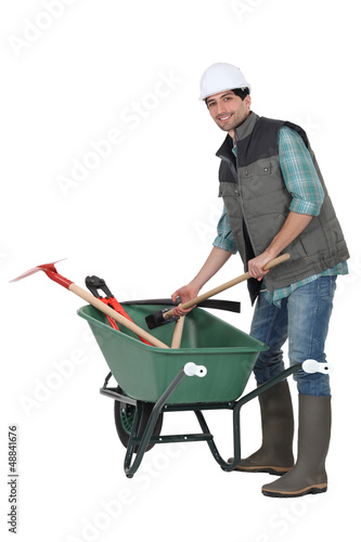 Photo: Laborer with wheelbarrow Laborer with wheelbarrow
