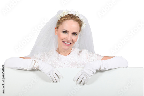 Photo: Bride with advertising board Bride with advertising board