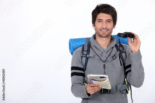 Photo: Backpacker with pair of binoculars Backpacker with pair of binoculars