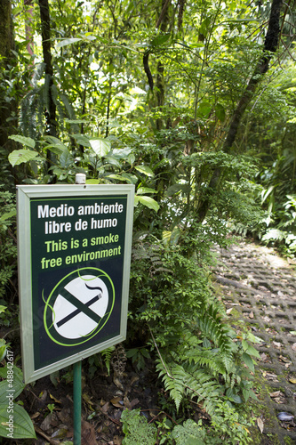 Photo: Smoke free environment sign in the forest Smoke free environment sign in the forest