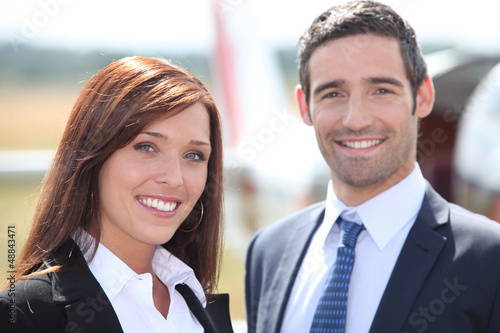 Photo: Couple in front of airplane Couple in front of airplane