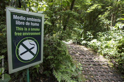 Photo: Smoke free environment sign in the forest Smoke free environment sign in the forest