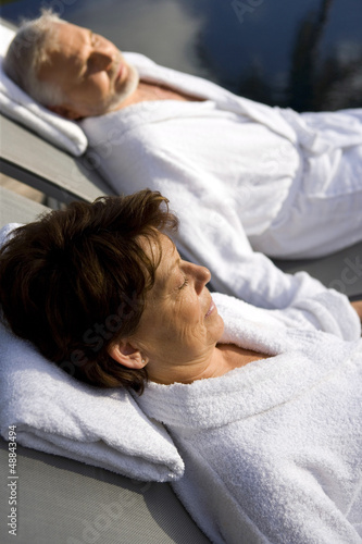Photo: senior couple on vacation wearing bathrobes senior couple on vacation wearing bathrobes