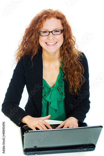 Photo: Pretty woman on laptop computer Pretty woman on laptop computer