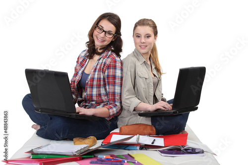Photo: Two female students with laptops Two female students with laptops