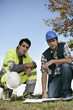 technicians studying a working project