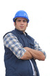 Portrait of a standoffish tradesman with his arms crossed