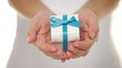 Gift box in female hands