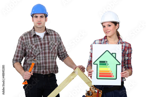 Photo: Couple stood with energy rating Couple stood with energy rating