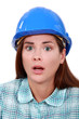 A scared female construction worker.