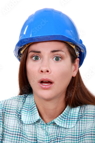 Photo: A scared female construction worker. A scared female construction worker.