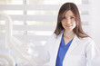 Portrait of a beautiful dentist at work