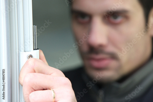 Photo: Man fitting new upvc windows Man fitting new upvc windows