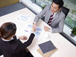 asian business people shaking hands in office