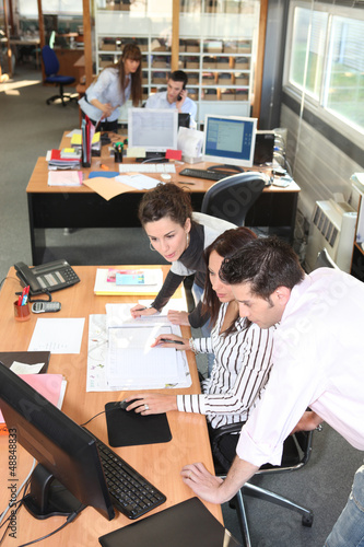 Photo: Portrait of a busy office Portrait of a busy office