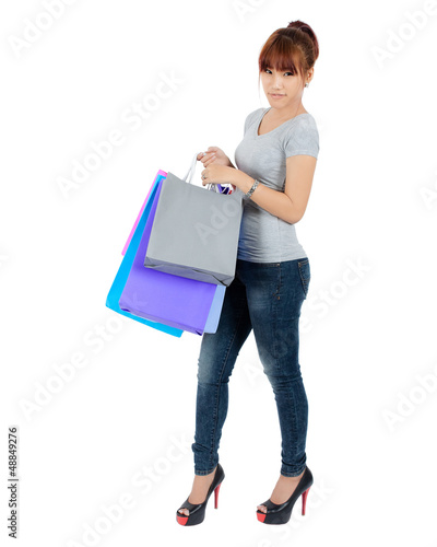 Photo: Isolated Yong Asian Woman With colorful Shopping Bags Isolated Yong Asian Woman With colorful Shopping Bags