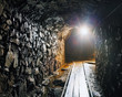 Photo: Mine with railroad track - underground mining Mine with railroad track - underground mining