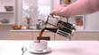 Coffee being poured in the kitchen
