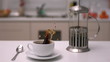 Sugar cube falling in coffee