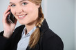 Young businesswoman smiling on the phone.