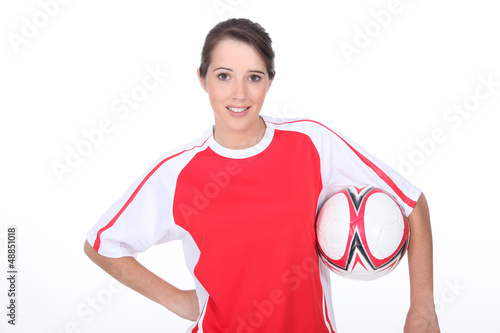 Photo: Girl holding football Girl holding football
