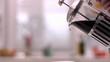 Cafetiere pouring coffee into cup