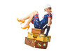 Photo: Young woman seat on vintage suitcases Young woman seat on vintage suitcases