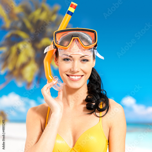 Photo: Portrait of happy beautiful woman at beach Portrait of happy beautiful woman at beach